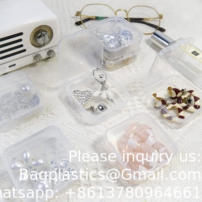 Kleine lege organisator met een gehengd deksel voor het opslaan van kleine voorwerpen, sieraden